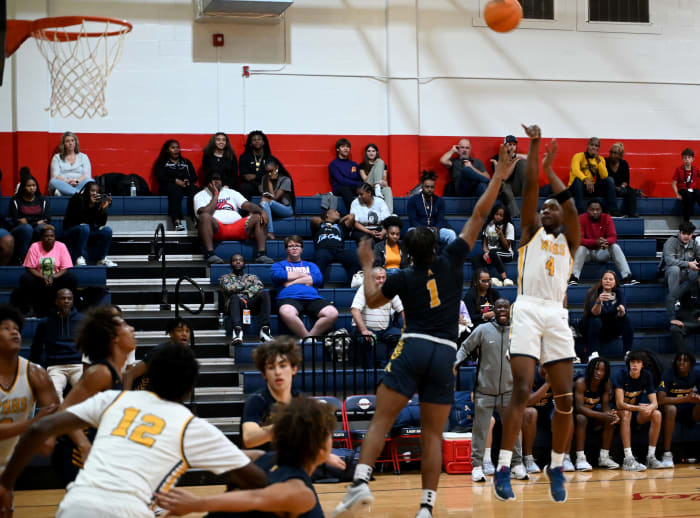 Winter Haven senior guard Isaac Celiscar fires up a jump shot during the first half of the championship game against St. Thomas Aquinas on Saturday at the Kingdom in the Sun Tournament at Vanguard High School in Ocala.